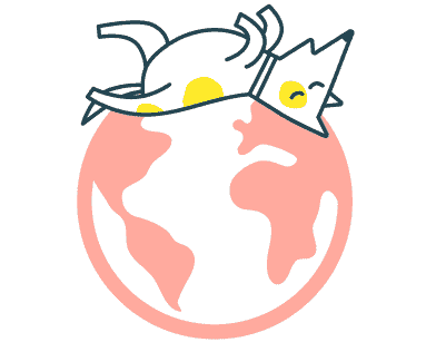 Custard the T4G dog laying on the world